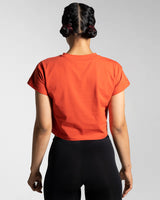 Back view of the red Drill Women’s Crop Tee, designed for unrestricted movement with a cooling and second-skin feel.