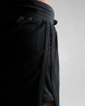 High-performance side seam of LYFTLYFE HIIT shorts in black.