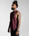 Left side view of Men’s sleeveless gym tank in dark wine color, designed with moisture-wicking fabric for breathability.