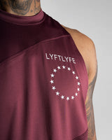 Close-up of white Lyftlyfe logo on left chest of Men’s Dominance Cut Sleeve tank in dark wine color. 