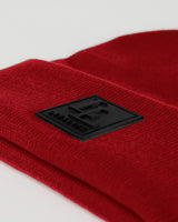 Close-up of 3D rubberized LYFTLYFE logo stitched on maroon toque.