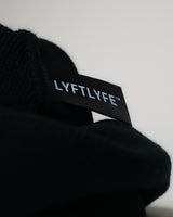 Interior view of LYFTLYFE black beanie showing woven brand label.