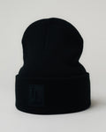 Front-facing blackLYFTLYFE beanie standing upright with bold 3D patch.