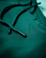 LYFTLYFE branded drawstring tip detail on ultra-soft green joggers. 