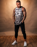 Front-facing view of the Men’s Command sleeveless shirt in black camo, highlighting its athletic design and premium performance fabric.