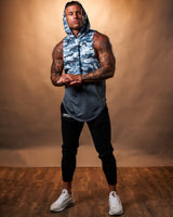 Men’s blue camo sleeveless hoodie with a long and loose fit, featuring a hood, wide arm openings, and a white Lyftlyfe logo on the left chest.