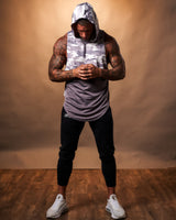 Men’s sleeveless gym hoodie in purple camo, featuring a moisture-wicking design and a lightweight hood for ultimate comfort.