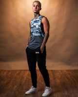 Side view of Women’s blue camo sleeveless tank top with a white Lyftlyfe logo on the left chest.