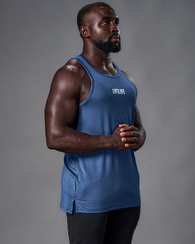 Mens tank top in blue. Rubberized white logo in the middle of the chest. 