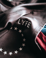 Close-up of soft, breathable tri-blend fabric on Men’s Dominance Cut Sleeve, highlighting its moisture-wicking properties.