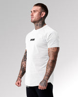 Right side view of the Contour Men’s T-Shirt in white, highlighting its athletic fit, breathable fabric, and high-quality stitching.