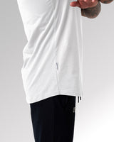 Close-up of the Dominate Adversity tag on the Contour Tee in white, highlighting premium craftsmanship and branding.