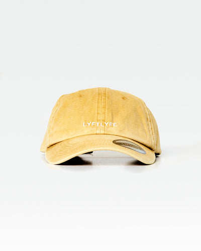 LYFTLYFE acid wash cap in yellow, front angle showing minimalist branding.