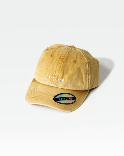 LYFTLYFE acid wash cap in yellow, front angle showing minimalist branding.
