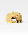 Rear view of yellow dad hat showing adjustable fabric strap and buckle.