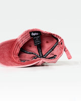 LYFTLYFE red dad hat interior close-up, featuring branded sweatband and care instructions.