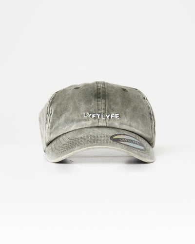 Front view of LYFTLYFE acid wash dad hat in green with curved bill and front logo embroidery.