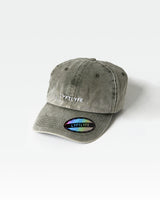 LYFTLYFE logo dad hat in green showing acid wash texture and structured front panel.