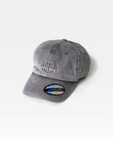 Curved brim dad hat in acid wash grey, side logo and front panel in focus.