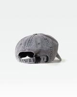 Rear view of grey dad hat showing adjustable fabric strap and buckle.